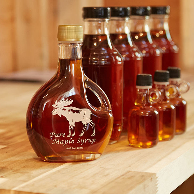 a picture of bottles of maple syrup with a lable that reads Pure Maple Syrup