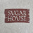 Used Metal Mazing Sugar House Sign (Brown)